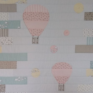 Balloon applique on baby quilt top