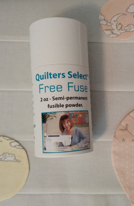 Free Fuse Semi Permanent fusible powerder for basting quilts or applique pieces.