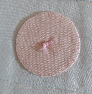 Pink Fabric Applique Circle on Baby Quilt
