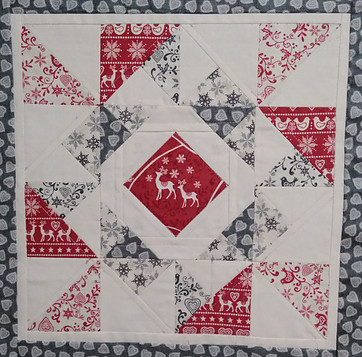 Quilted pillow top using Scandi fabric scraps