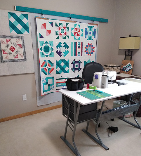 Sewing Room with sewing desk and design wall in background
