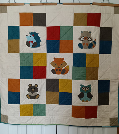 Woodland critters applique quilt using high volume fabrics from Laundry Basket Quilts