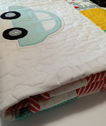 Baby quilt made from 'On the Go' fabric from Stacy Hest Hsu
