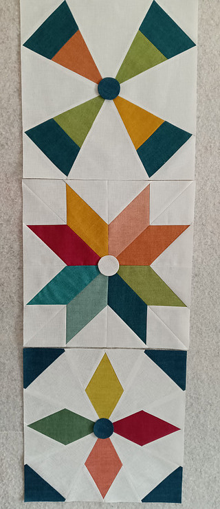 Modified Blocks 1-3 with a round applique in the middle to hide mis-matched points