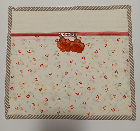 Project bag made f rom Happy Days fabric, a Happy Zipper and coral flower buttons used as zipper pulls