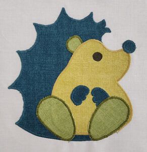 Applique blue and green hedgehog from Avery lane's Woodland Critters quilt pattern