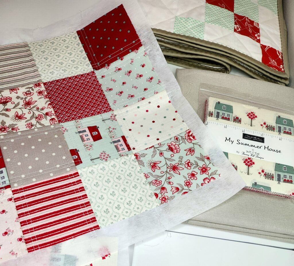 My Summer House by Bunny Hill charm pack 5" fabric squares sewn onto a 6x6 adhesive interfacing panel.   