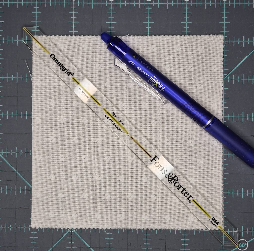 Square fabric with seam ruler and marking pen